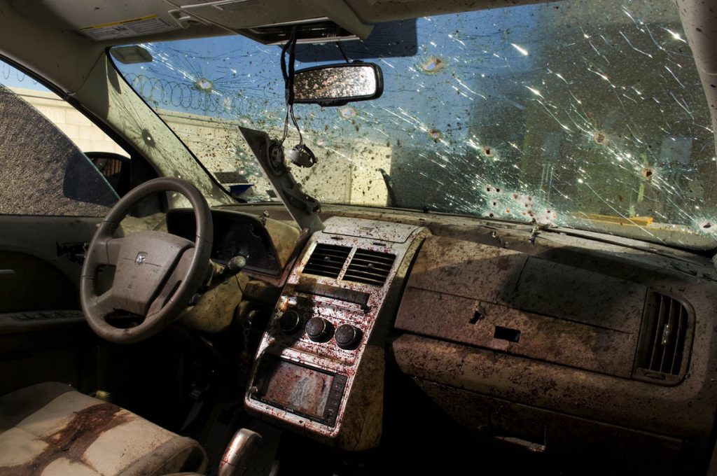 JUAREZ, MEXICO: DEC. 17, 2008 - Inside the car where a man and a woman were gunned down by assassins. The death industry is booming in the city of Juarez. Since Mexican President Felipi Calderon launched a 'war on drugs' at the start of 2007 Mexico has seen nothing but bloodshed -- the number of murders has quadrupled in Juarez and doubled across the country -- With approx. 1,600 deaths in 2008, Jaurez is now the deadliest city in the world, per capita. (Photo by Shaul Schwarz Reportage/Getty)